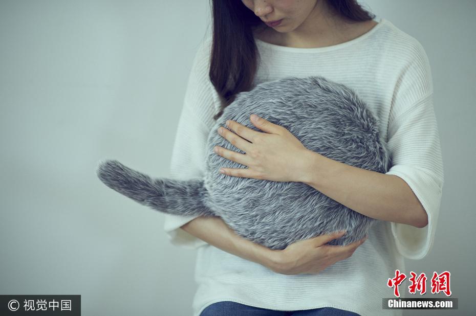 IM体育App,日本推出治愈系猫尾机器人 USB充电可随意安抚